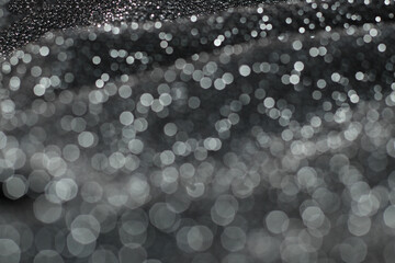 Wall Mural - Texture with bokeh of shiny lurex fabric silver and black color.