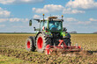 Tractor with cultivator working in the field | 5085