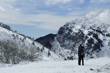 Wall Mural - Couple in love on the snowy mountain