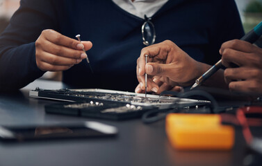 Aufkleber - Whatevers wrong, theyll make it right. Shot of two technicians repairing a laptop together.