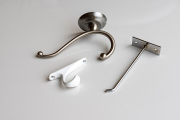 Wall Mural - Different wall hooks on white background