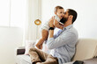 © kleberpicui - Father and his baby son playing at home