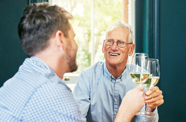 Poster - Heres to you and me dad. Shot of a cheerful elderly man and his son sharing a celebratory toast with wine glasses at home.