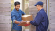 © Mariusz S/peopleimages.com - Delivery with a smile. A friendly delivery man delivering a package to a home.
