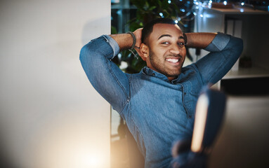 Poster - I stayed late for this exact moment. Portrait of a young businessman taking a break at his desk in a modern office.