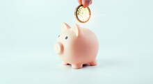 Save Currency Bitcoin. Pink Pig Bank With Golden Bit Coin Money BTC On White Background. Save Money Investment And Business Finance.