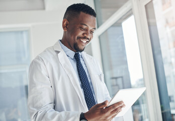 Poster - I found the information I needed. Shot of a young doctor using a digital tablet in an office.