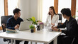 © bongkarn - A marketing team having a meeting with executive manager