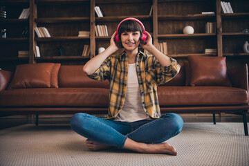 Wall Mural - Full size photo of cute millennial bang hairdo lady listen music wear shirt jeans bare foot at home loft flat alone