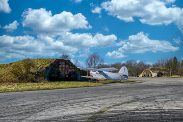 Wall Mural - Bunkers and planes on an old Russian airfield