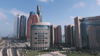 Canvas Print - Aerial view of Abu Dhabi Downtown skyscrapers, going up in the sky on a sunny day, UAE