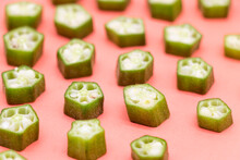 Okra Slices Isolated On Colorful Background, Selective Focus