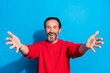 © deagreez - Portrait of attractive cheerful kind man hugging you welcome isolated over bright blue color background