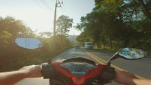 Tourist Motorcyclist Riding Bike On Highway In Phuket, Thailand. POV Shot, Through Jungle Trees And Greenery, On Board Camera, Beautiful Sunny Day, Travel Concept, Rent A Scooter