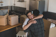 © ReeldealHD images - Mid adult couple hugging in their new home