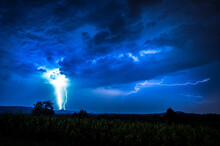 Breathtaking View Of A Thunderstorm From A Field