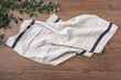 Linen cloth, kitchen towel, tablecloth on dark wood table