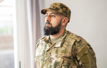 male veteran soldier with beard and military uniform