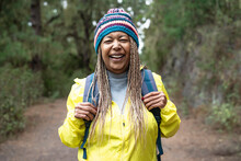 Happy Afro Senior Woman Having A Walk In The Woods - Adventure And Travel People Concept