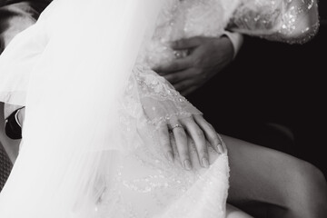 wedding of a beautiful, stylish couple, a bride in a white wedding dress and a groom in a black suit