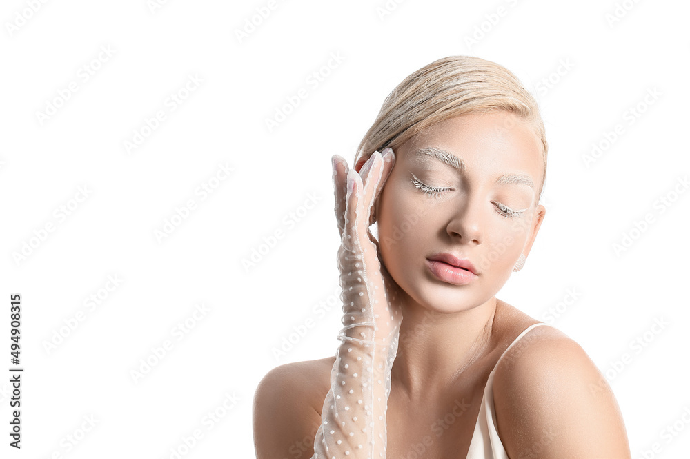 Beautiful young woman with creative makeup and elegant gloves on white background