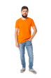 © Pixel-Shot - Handsome man in bright orange t-shirt on white background