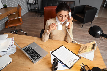 Poster - Female notary public talking by phone in office