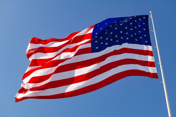 American flag against a blue sky