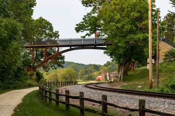 View of a walking bridge over a railroad in the park