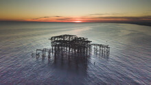 Aerial View Of The Brighton West Pier In Brighton, England On A Sunset Sky Background