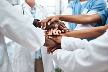 Canvas Print - The value of collaboration is immeasurable. Closeup shot of a group of medical practitioners joining their hands together in a huddle.