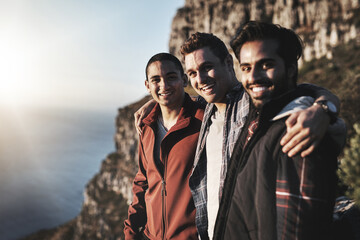 Wall Mural - Proud to say weve conquered this mountain. Portrait of a group of friends admiring the view while hiking in the mountains.