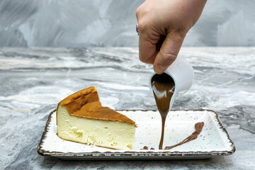 Sticker - Closeup shot of the San Sebastian Cheesecake on a marble floor