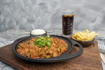 Wall Mural - Closeup of traditional Turkish food meat saute on the serving plate