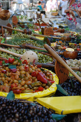 Vertical shot of various types of olives in a market in France