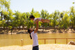 © Antonio Tanaka - portrait of a Hispanic father and baby in a park smiling and having fun