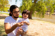 © Antonio Tanaka - portrait of a Hispanic father and baby in a park smiling and having fun