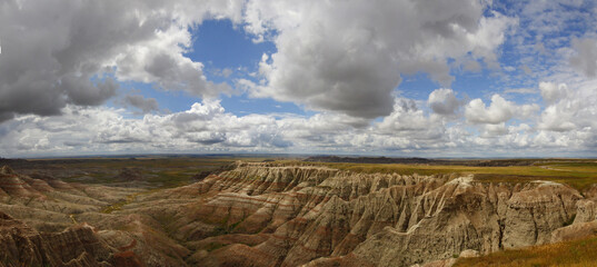 Wall Mural - Panoramic view of desert mountains landscape in the cloudy sky.