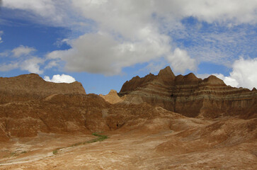 Wall Mural - View of desert mountains landscape in the cloudy sky.