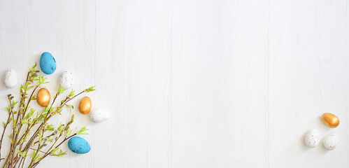 Wall Mural - branches with green leaves and easter eggs on a light background. happy easter flat lay concept