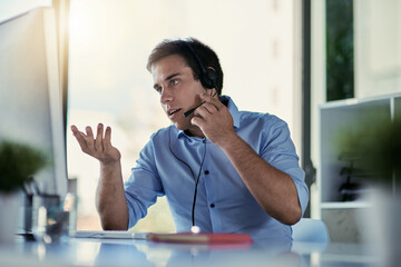 Poster - Talking a client through resolving their issue. Cropped shot of a call centre agent working in an office.