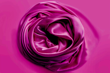 Wall Mural - beautiful satin fabric draped with soft folds in a rose, silk cloth background, close-up, copy space