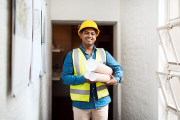 Poster - I cant wait to start working on this space. Shot of a young engineer holding blueprints on a construction site.