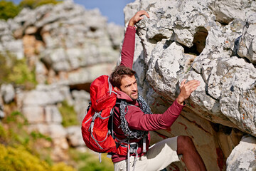 Poster - Almost at the top. Shot of a young man enjoying a hike through the mountains.