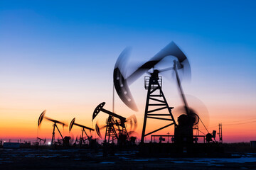 Wall Mural - In the evening, oil pumps are running, Silhouette of beam pumping unit