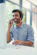 © Camerene Pendl/peopleimages.com - Hes ready to assist. Cropped shot of a call centre agent working in an office.