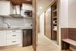 © Toyakisfoto.photos - hotel room with french kitchen with wooden doors and safe inside a closet with sliding wooden doors