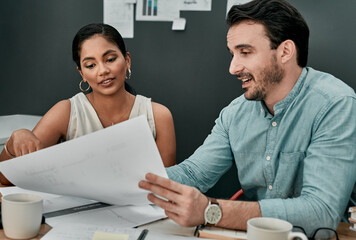 Aufkleber - They have it all planned out to perfection. Shot of two architects working with blueprints in an office.