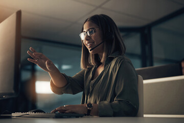 Poster - Giving clear instructions for the solutions. Shot of a call centre agent working in an office at night.