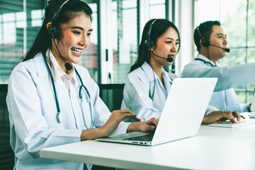 Poster - doctor team wearing headset talking actively on video call in hospital clinic . concept of telehealt
